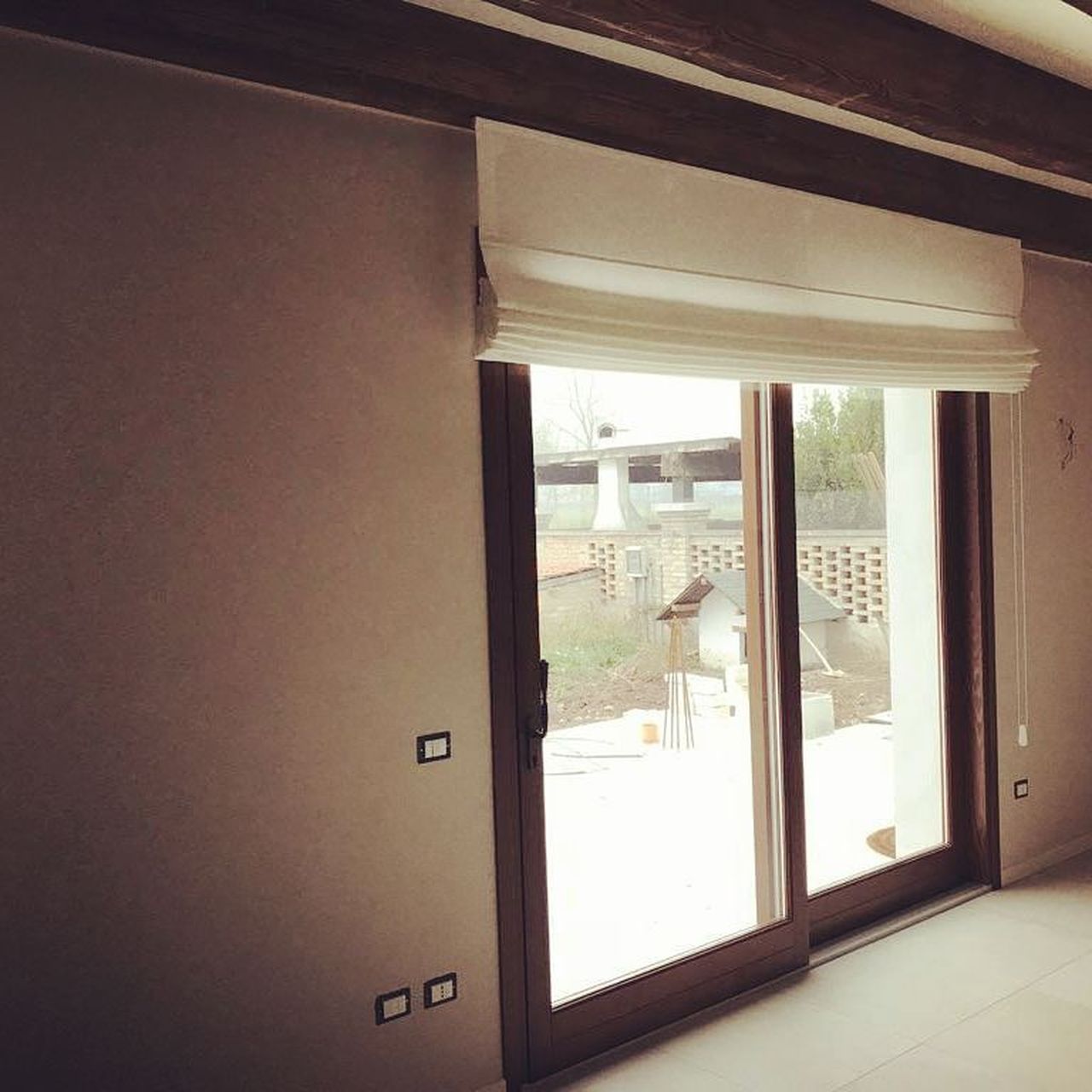 Bassi porte finestre scorrevoli legno e PVC Bagnolo Mella (Brescia)
